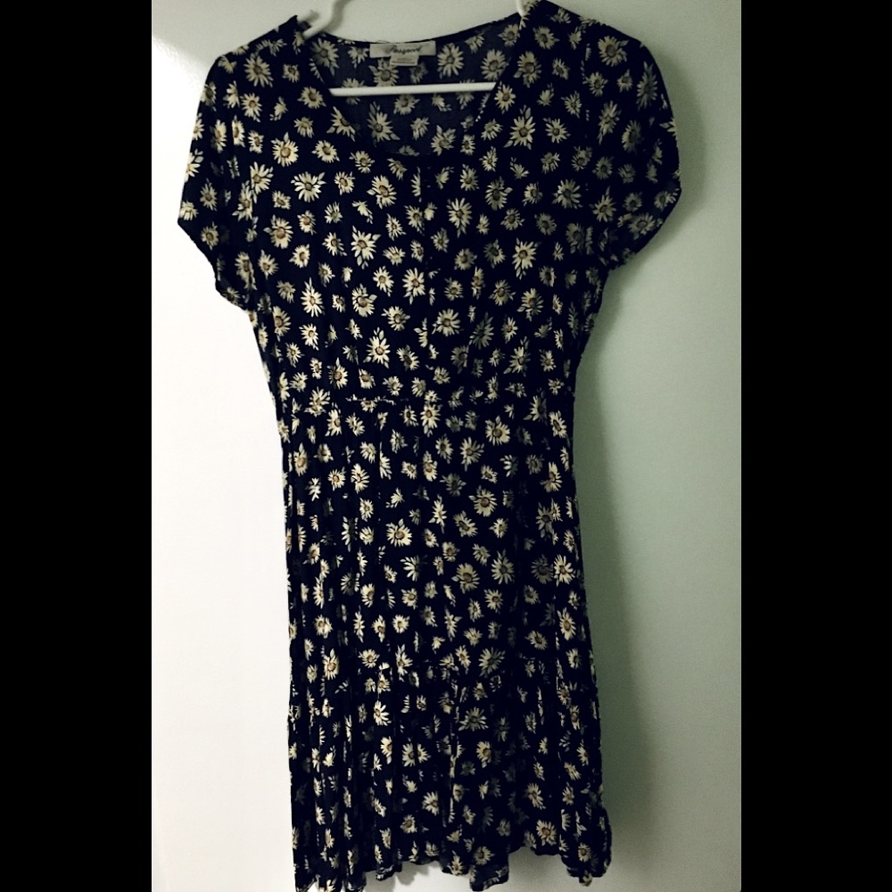 A sunflower knee high dark blue drees gently worn